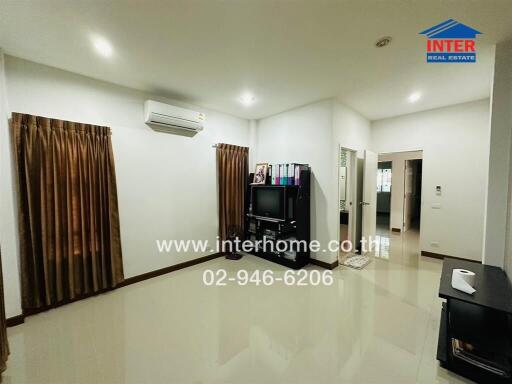 Spacious and well-lit living room with modern amenities