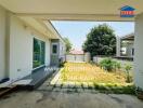 Spacious outdoor patio with covered area and sliding door access to the house