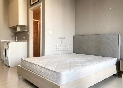 modern bedroom with integrated laundry area