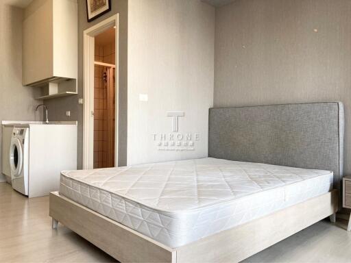 modern bedroom with integrated laundry area