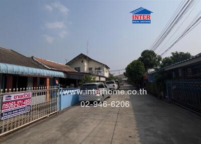 Exterior view of a residential area with street and homes