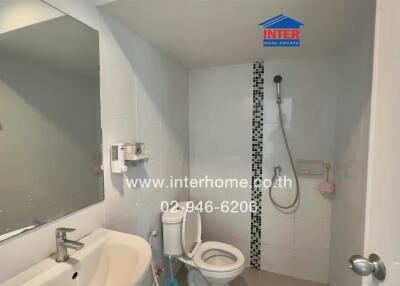 Compact bathroom with modern amenities and clean design