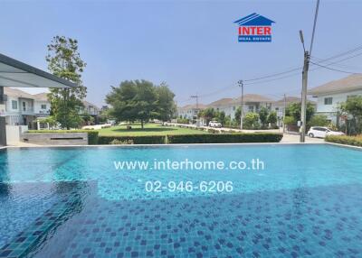 Luxurious outdoor swimming pool with surrounding residential housing