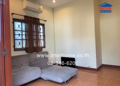 Spacious bedroom with air conditioning and large window