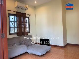 Spacious bedroom with air conditioning and large window