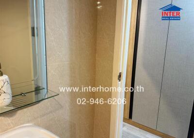 Modern bathroom with glass shower and marble tiles