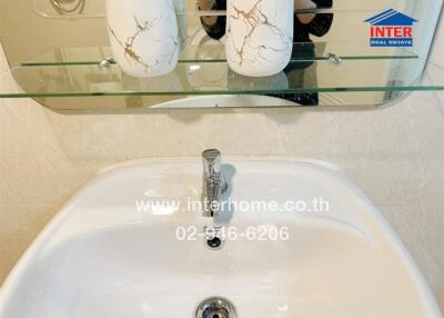 Elegant bathroom sink with decorative vases