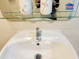 Elegant bathroom sink with decorative vases