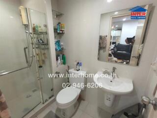 Modern bathroom with shower and vanity mirror