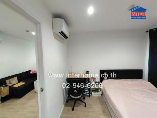 Spacious and well-lit bedroom with modern amenities