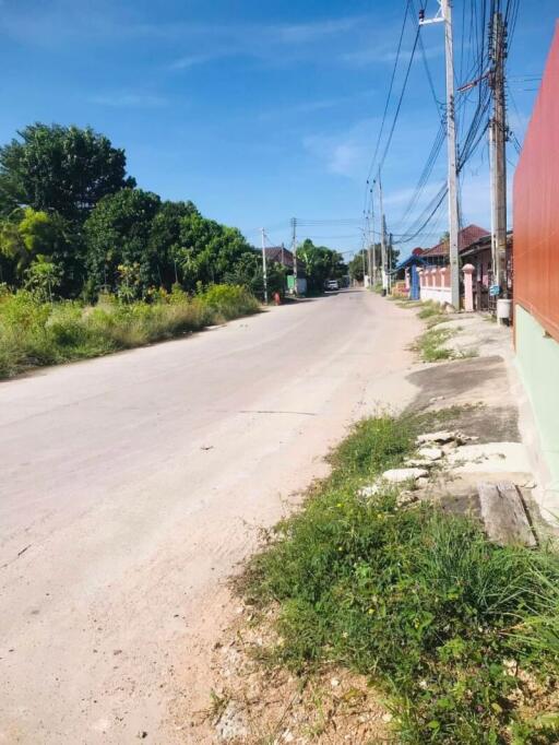 Street view of a residential area with paved road