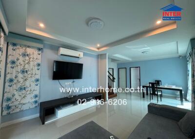 Modern and spacious living room with dining area