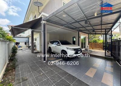 Spacious driveway with covered parking and tiled floor in modern home