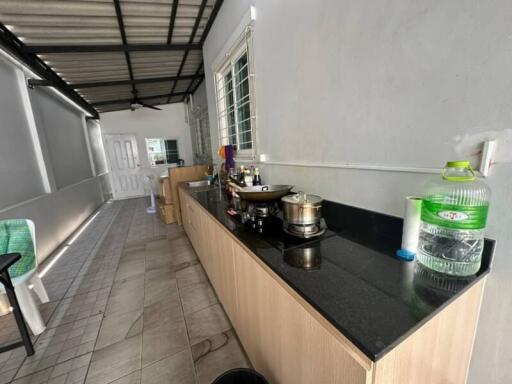 Spacious semi-outdoor kitchen with modern amenities