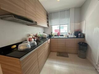 Modern kitchen with wooden cabinetry and fully equipped cooking area
