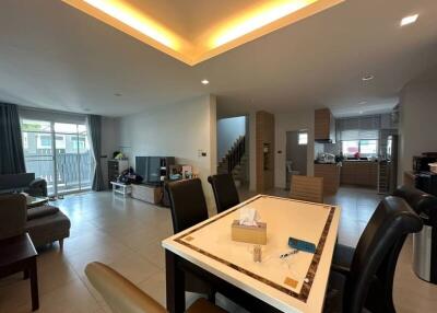 Spacious and contemporary living room with dining area and ambient lighting