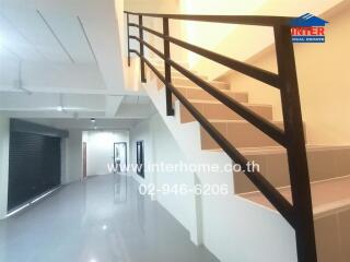 Modern spacious hallway with railing and elegant flooring