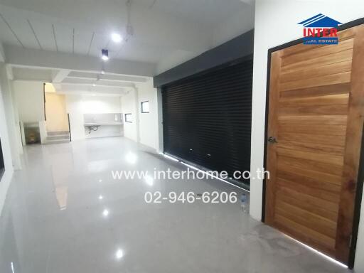 Spacious modern building interior with glossy floors and multiple lighting options