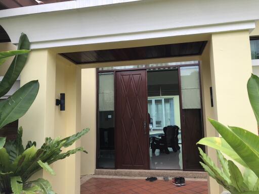 Front entrance of a modern home with large wooden door