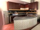 Spacious kitchen with modern appliances and ample cabinetry
