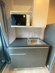 Compact modern kitchenette with integrated appliances