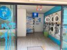 Modern public laundry room with multiple washing machines