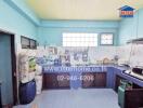 Spacious kitchen with blue tiles and ample storage