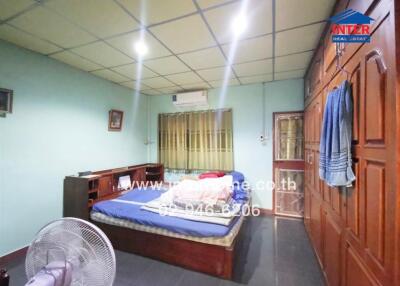 Spacious bedroom with large bed and ample lighting