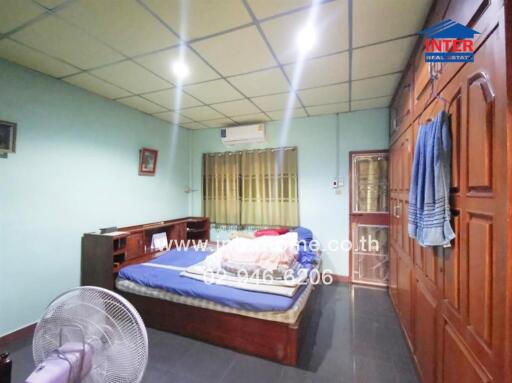 Spacious bedroom with large bed and ample lighting