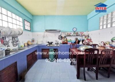 Spacious kitchen with dining area and large counter space