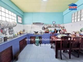 Spacious kitchen with dining area and large counter space