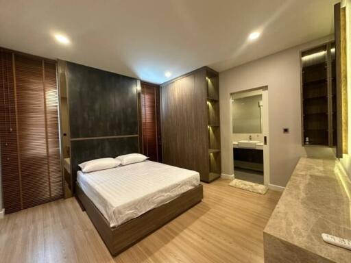 Modern bedroom with ensuite bathroom and stylish decor