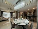 Modern and spacious living room with dining area and adjoining kitchen