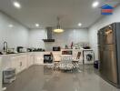 Spacious modern kitchen with stainless steel appliances and ample storage