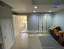 Well-lit entrance hall leading to the house interior and garage