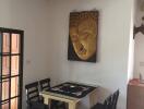 Spacious dining room with Buddha artwork and modern furnishing