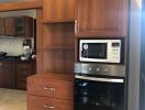 Modern kitchen with built-in appliances and wooden cabinetry