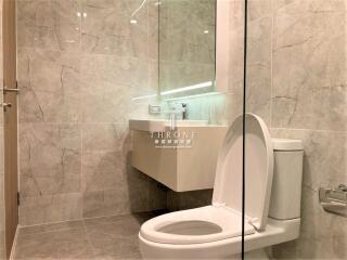 Modern bathroom interior with marble walls and sleek fixtures