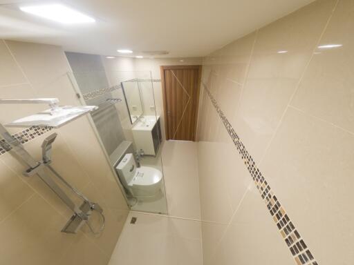Spacious modern bathroom with shower and toilet