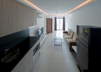 Modern kitchen and living room with integrated appliances