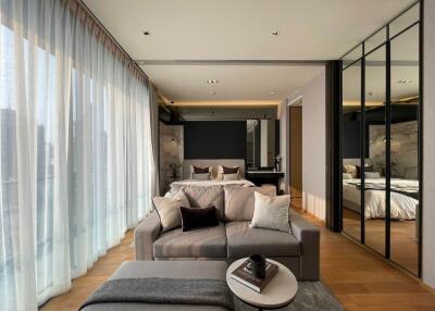 Modern living room with open view to bedroom