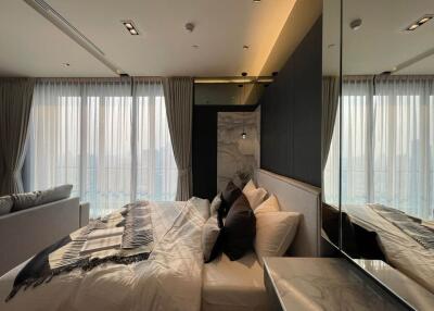 Modern bedroom with large windows and elegant interior design