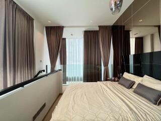 Elegant bedroom with large windows and modern decor