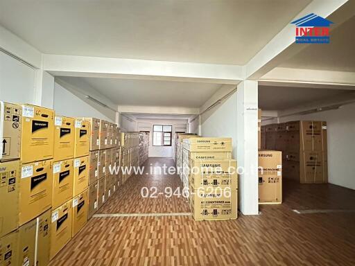 Spacious commercial storage room filled with many cardboard boxes