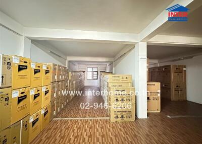 Spacious commercial storage room filled with many cardboard boxes