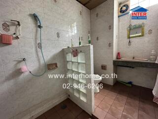 Spacious bathroom with shower and ample storage