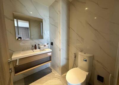 Modern bathroom interior with elegant marble tiles and fixtures