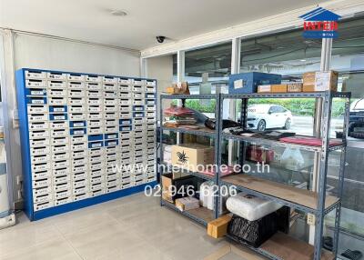 Well-organized storage space with shelving and numerous labeled boxes