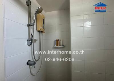Bathroom interior with wall-mounted shower and water heater