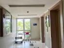 Spacious hallway in a residential building with natural light